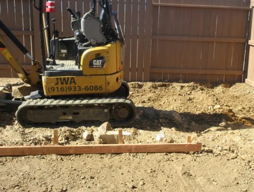 We didn’t count on a huge boulder burried in the backyard